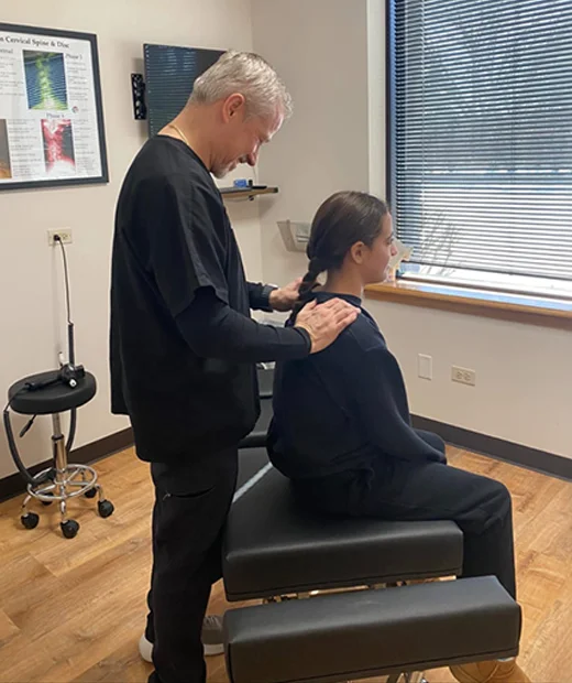Dr. Richard Hunn adjusting a patient's back